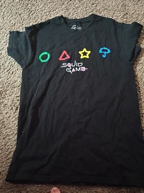 Netflix Squid Game Black Short Sleeve T‑Shirt with Green Red Yellow Blue Symbols